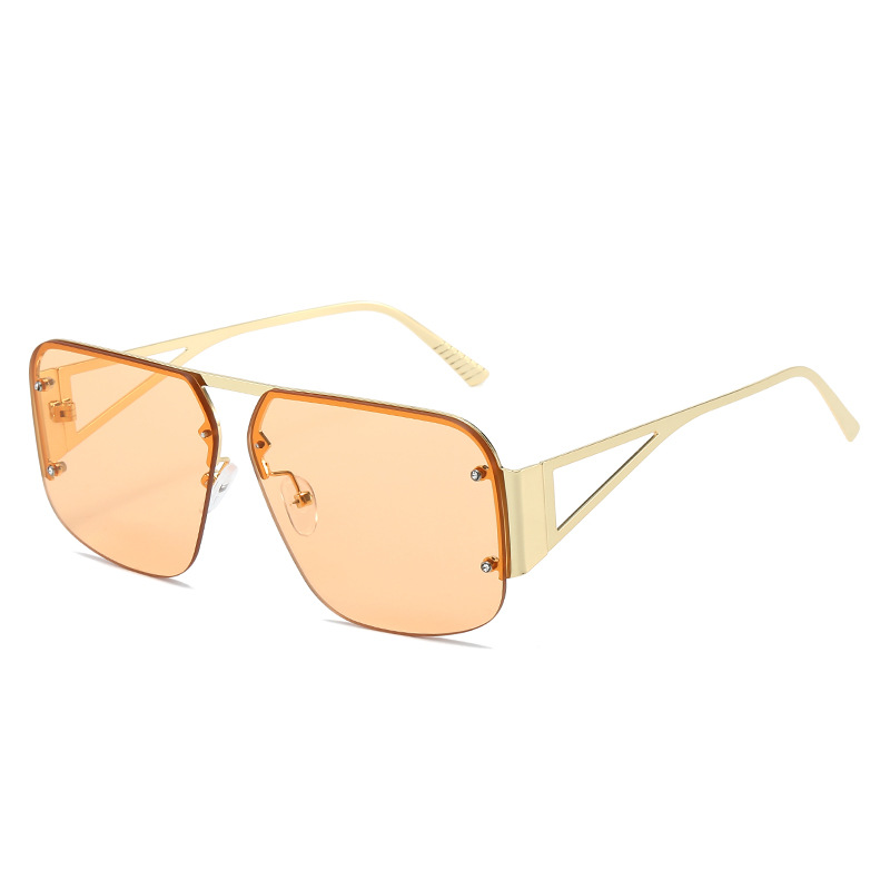 Ultra chic gold sunglasses with orange lens