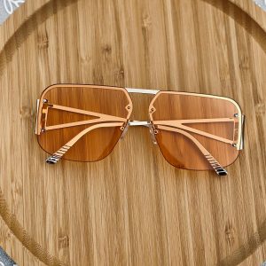 A summer staple gold sunglasses