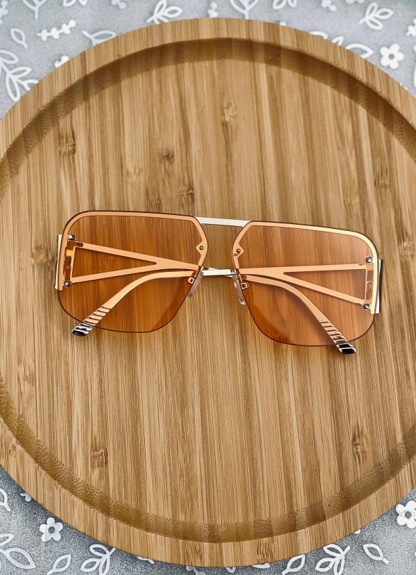 A summer staple gold sunglasses